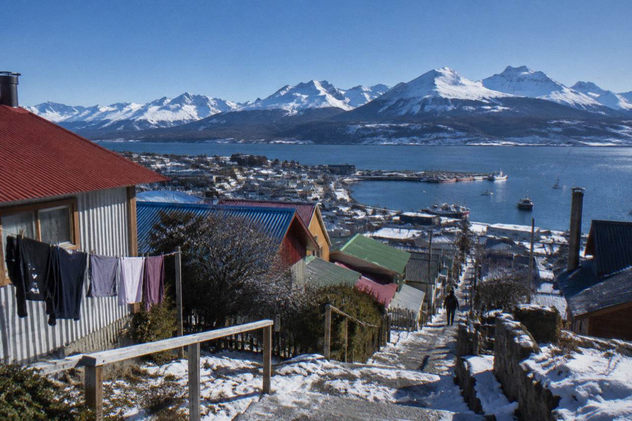 Colourful buildings of Ushuaia backed by the Martial mountains and the Beagle Channel