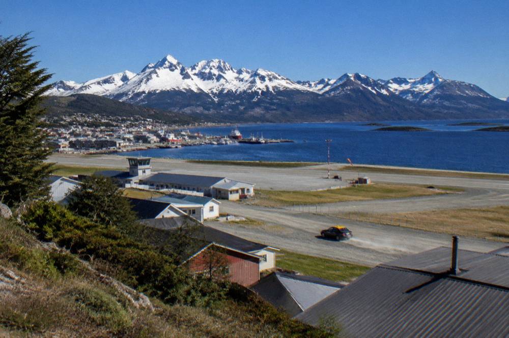 The town of Ushuaia and its harbour beneath snowy mountains