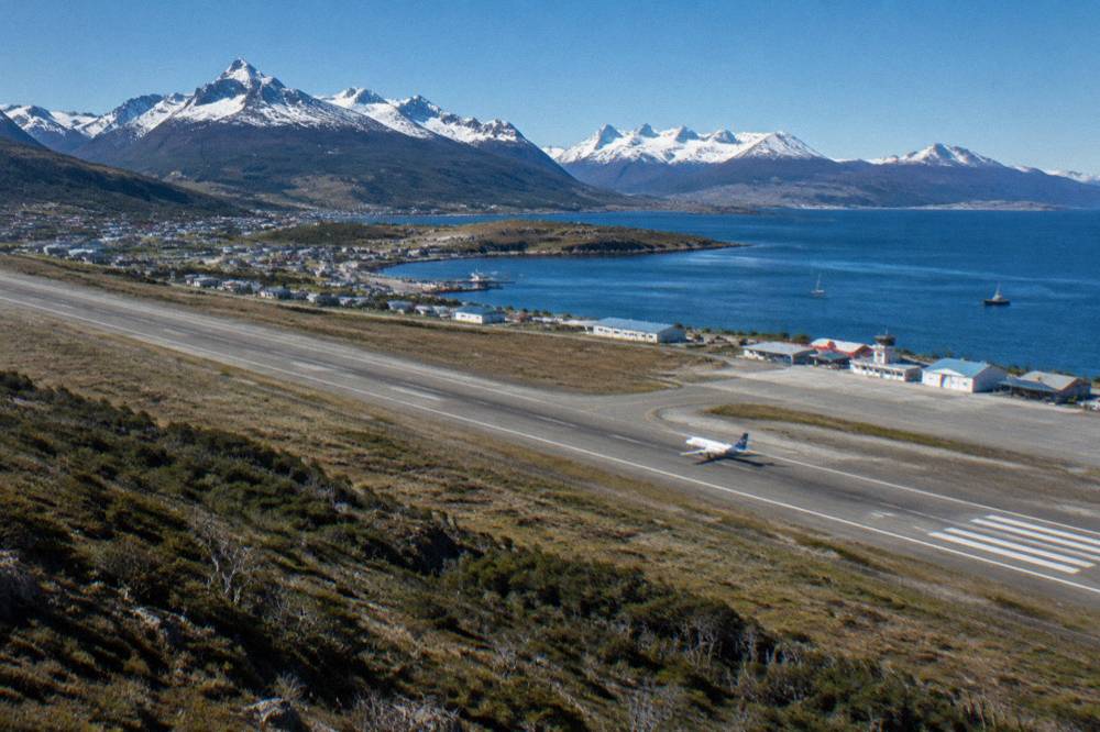 Aerial view of Ushuaia with the airport runway and the Beagle Channel