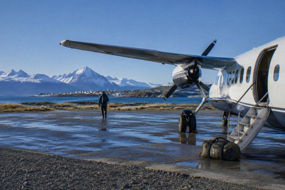 Small charter aircraft on a runway in southern Patagonia preparing for an Antarctic flight